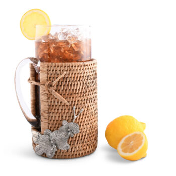 Vagabond House Orchids Glass Pitcher W/Hand Woven Wicker Rattan Cover 10.5″T