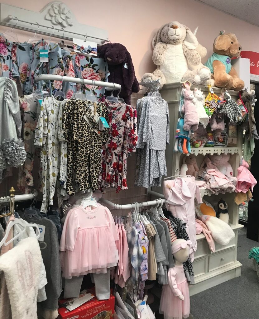 Baby clothes and toys at The Pink Daisy.